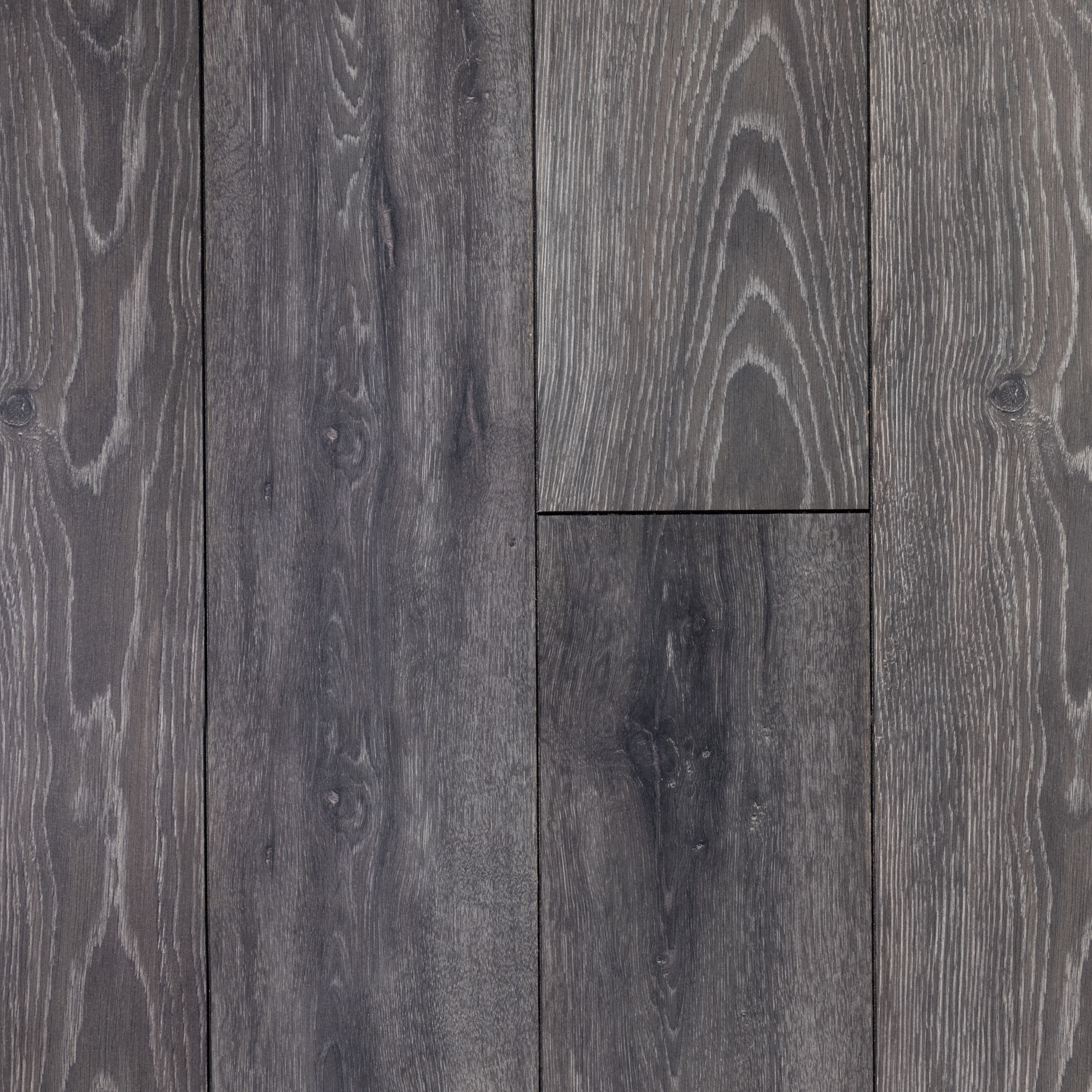 A close up of Laminate Flooring's Bedrock Oak with grey stain.