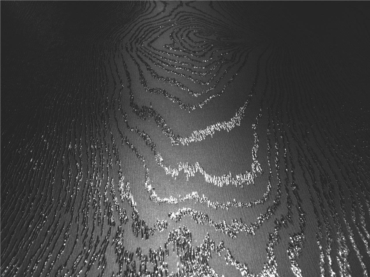 a black and white photo of a waves detail.
