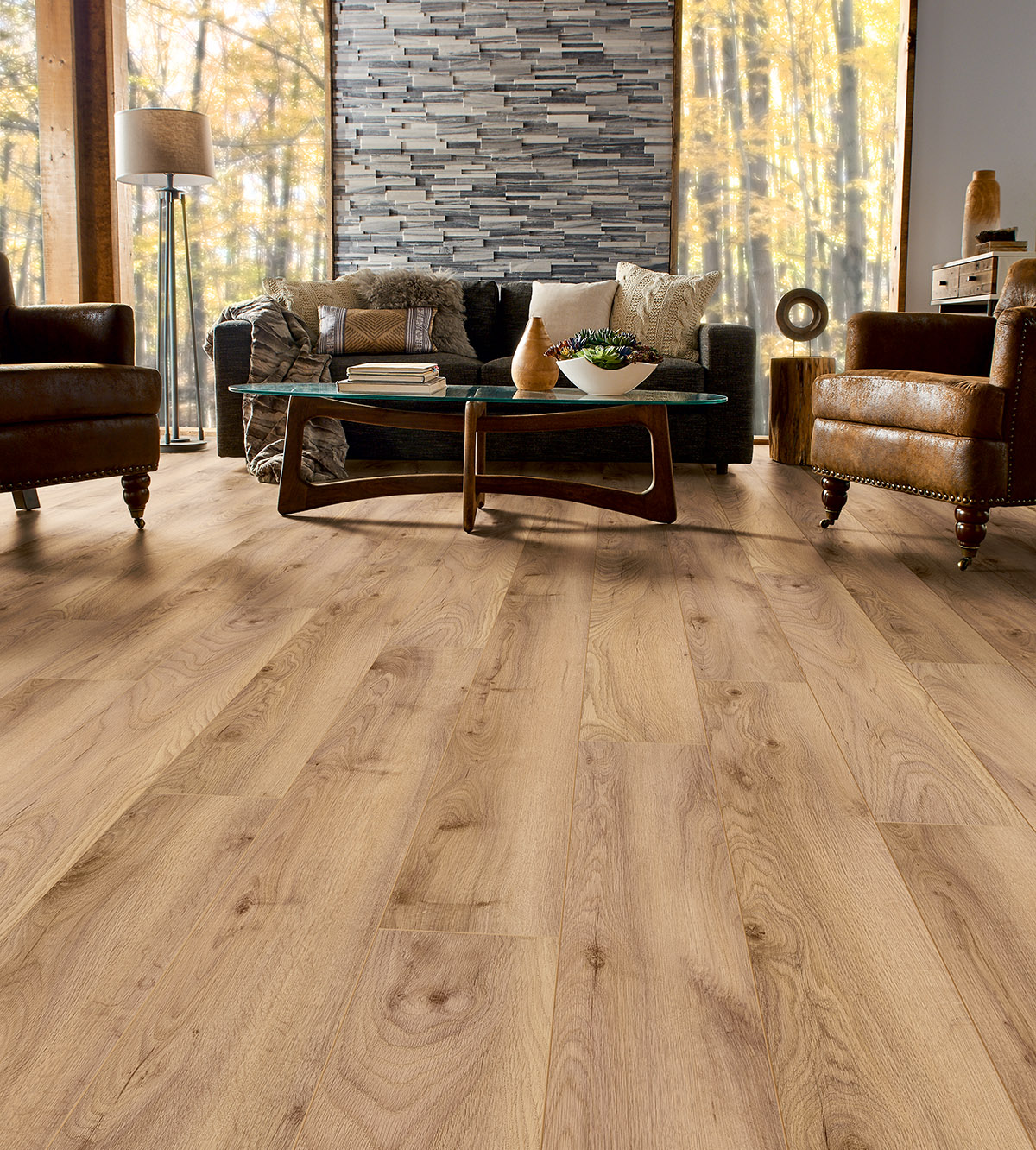 K504 Tuscan Manor Oak flooring in an elegant living room with refined furniture, blending interior style with the nature outside
