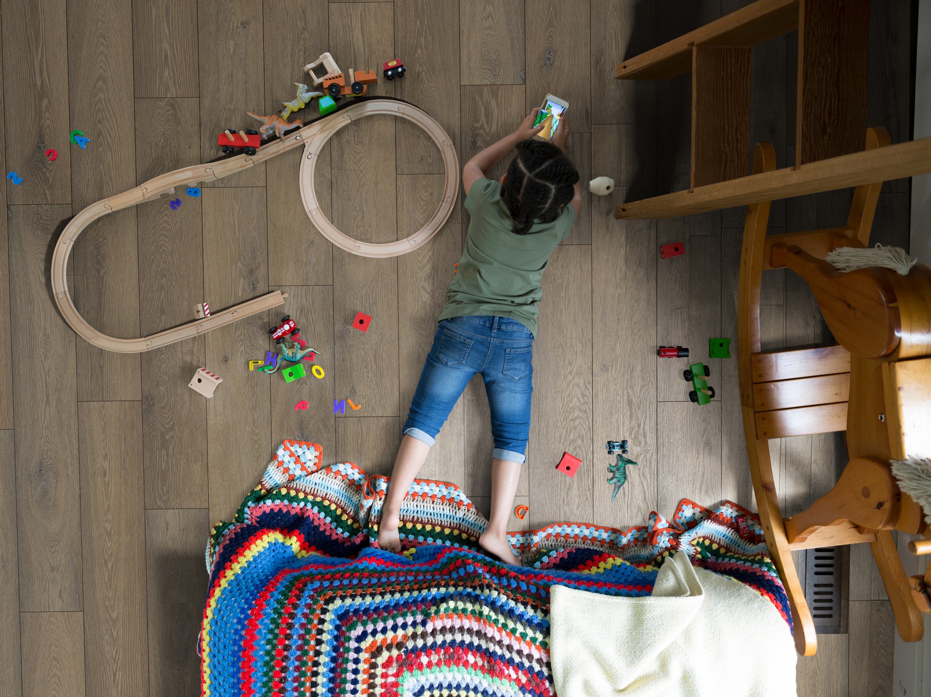 Child playing on durable and comfortable R067 Bourbon Cask 5+1 SPC flooring