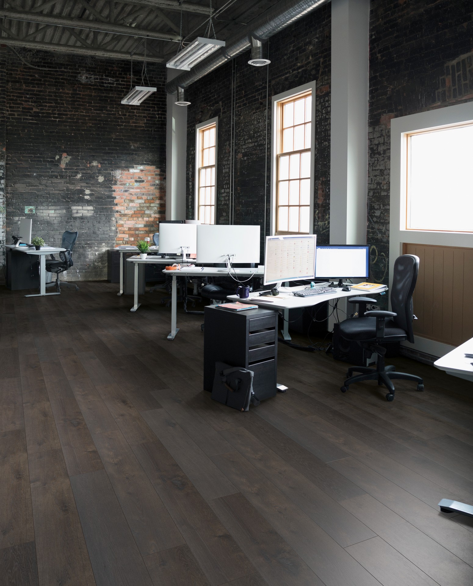 R064 SPC flooring - dark brown - wood design - wide plank In a beautiful office 