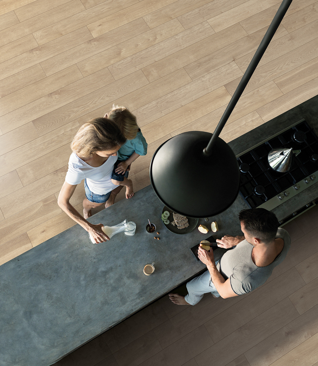 Top view of R065 ROCKO 5+1 SPC flooring with a family preparing breakfast