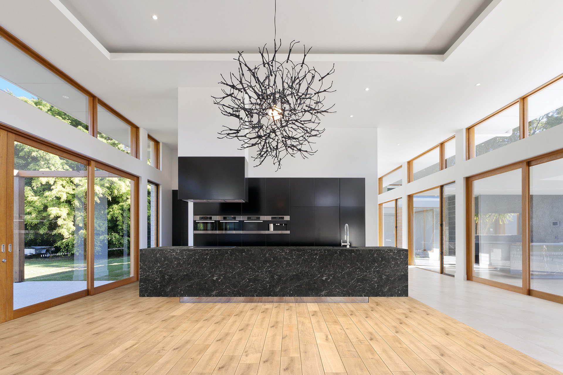 R077 Barista 5+1 SPC flooring in a spacious open-plan living room with modern furniture