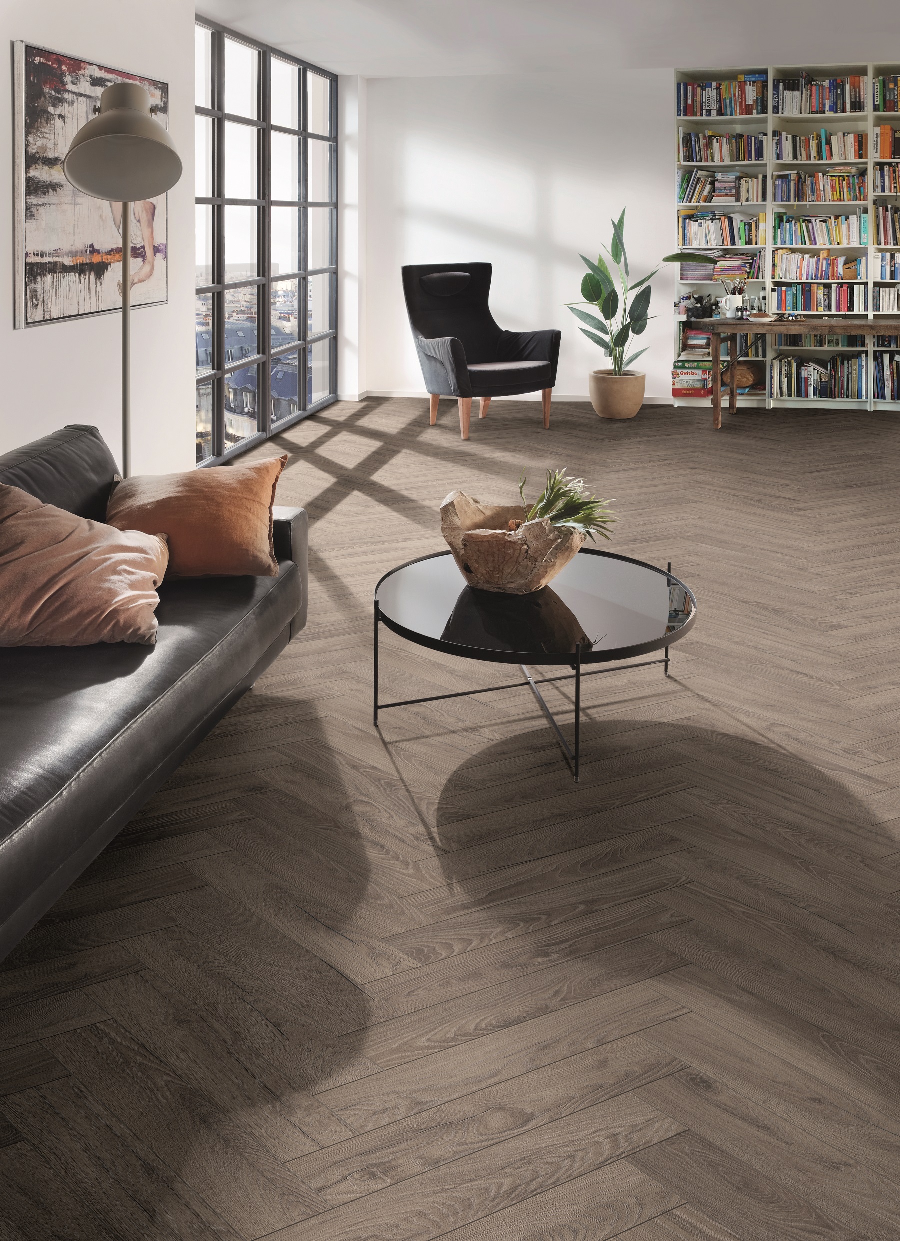 Elegant room with K488 Rutherford Oak - a laminate flooring with a herringbone pattern, adding warmth and sophistication to the space.