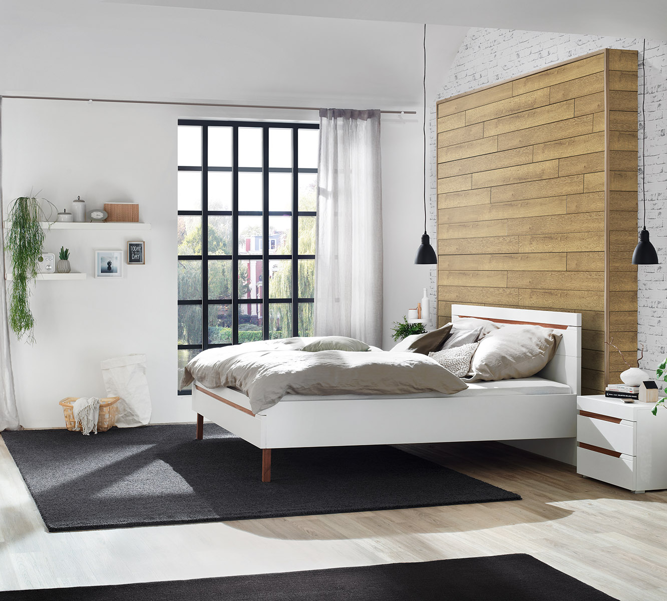 Cozy bedroom accentuated by the warm K326 Sundance Oak Wall Panel.