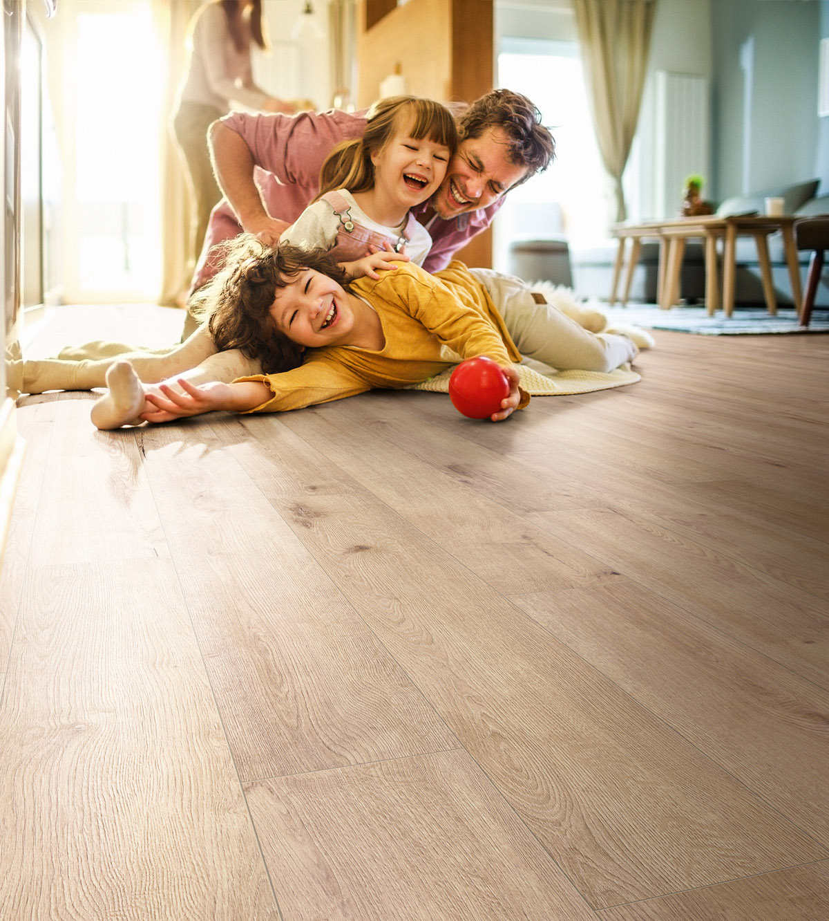 Family playing on K501 Sand River Oak oak flooring – comfortable, durable, and perfect for everyday living