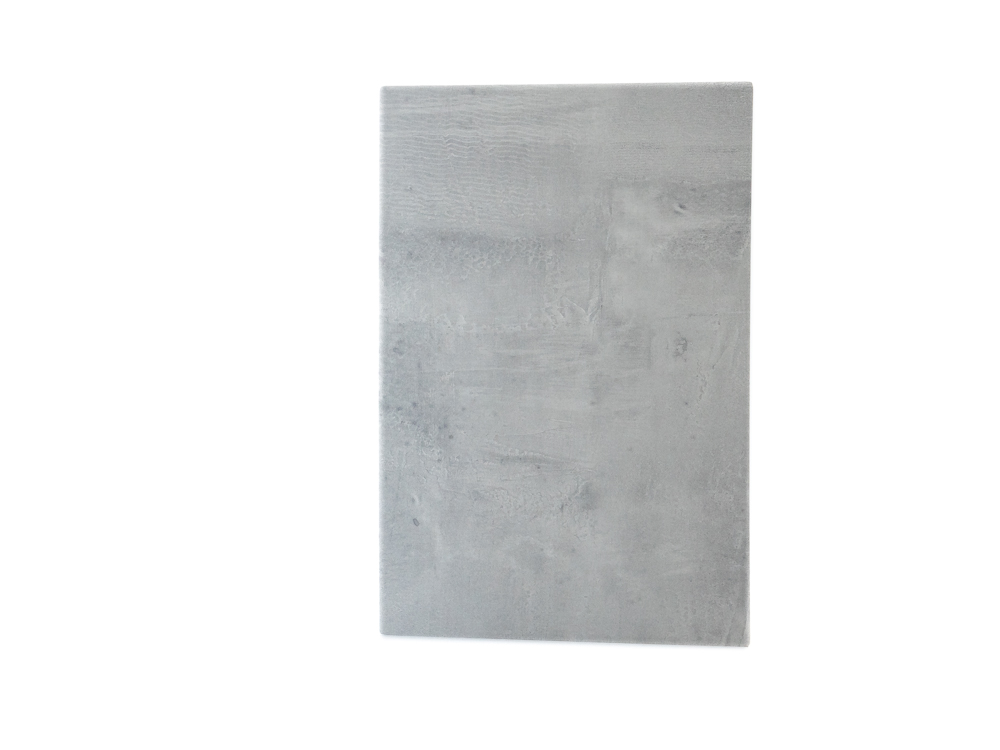 Close-up image of the K028 Portland SU product, showcasing its textured surface with a light grey color reminiscent of Portland stone.