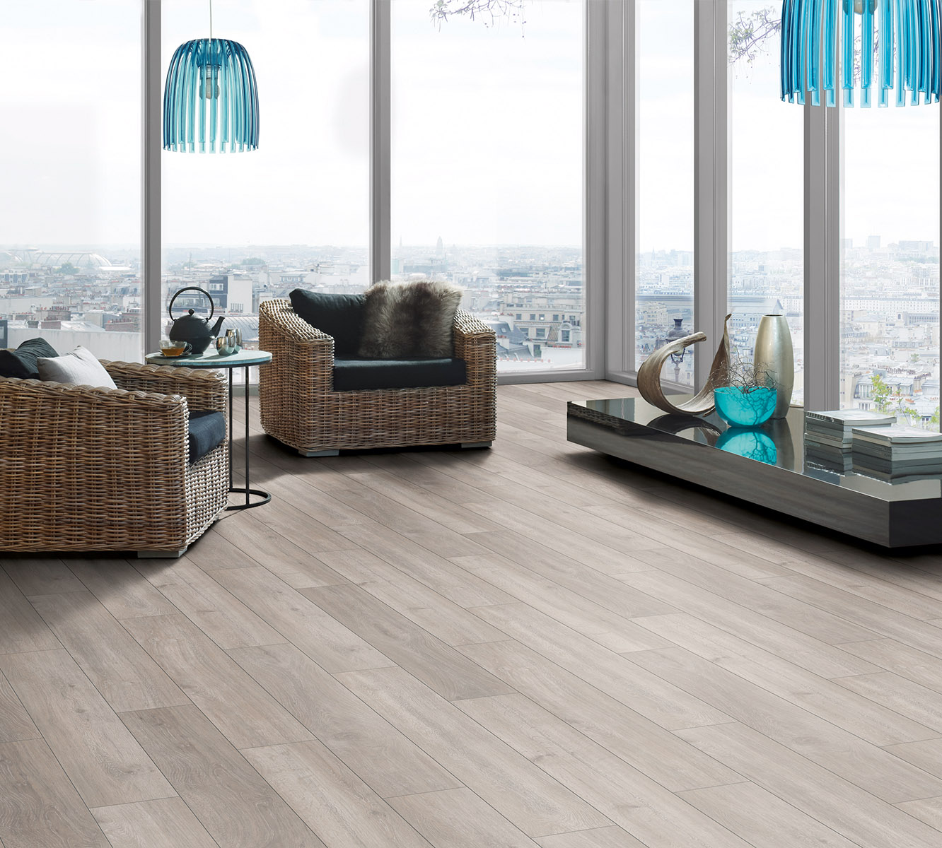 Rockford Oak laminate flooring in modern living room with dark minimalist furniture and bright natural light