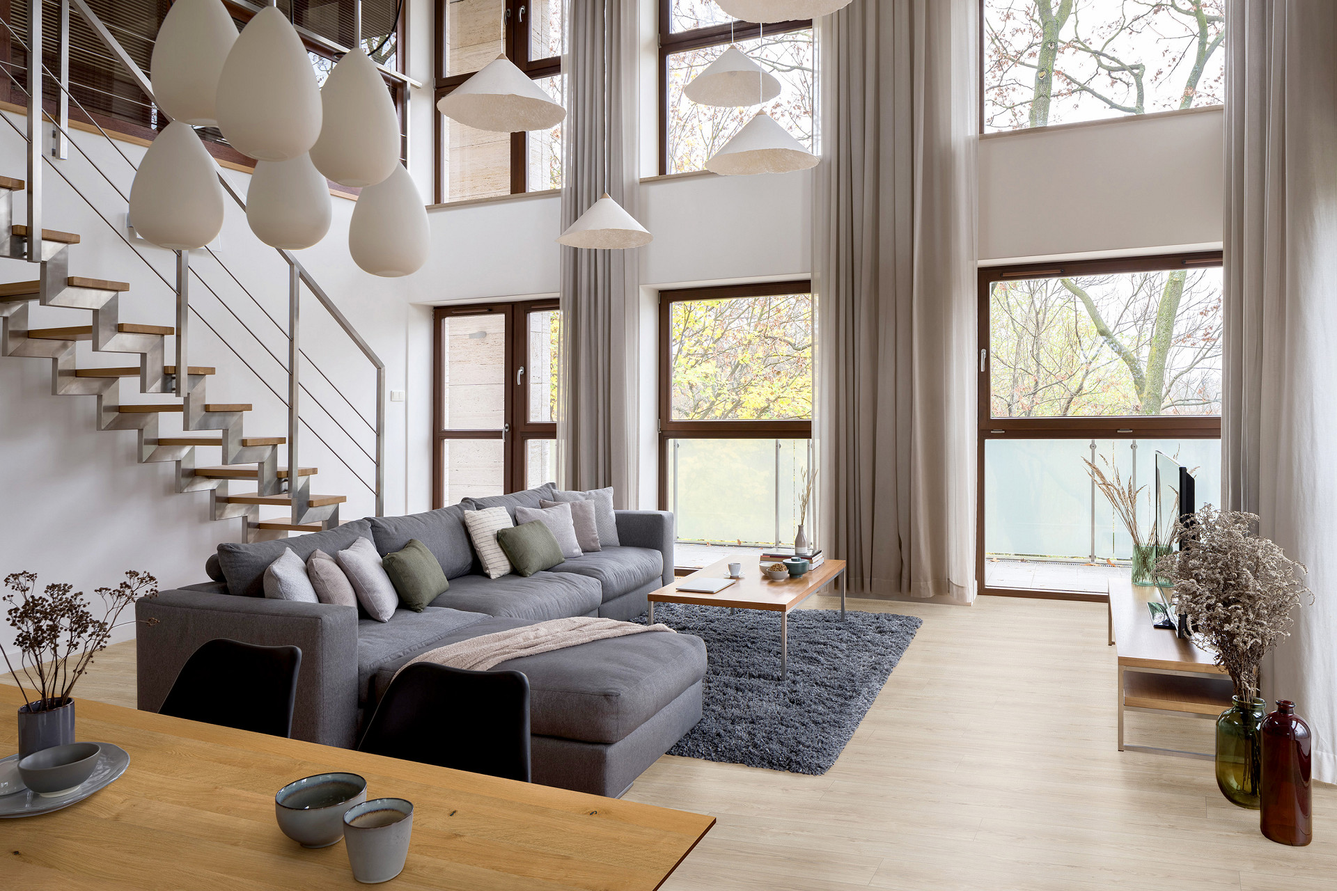 K485 Natural Sterling Oak' flooring adding warmth and elegance to a cozy living room.