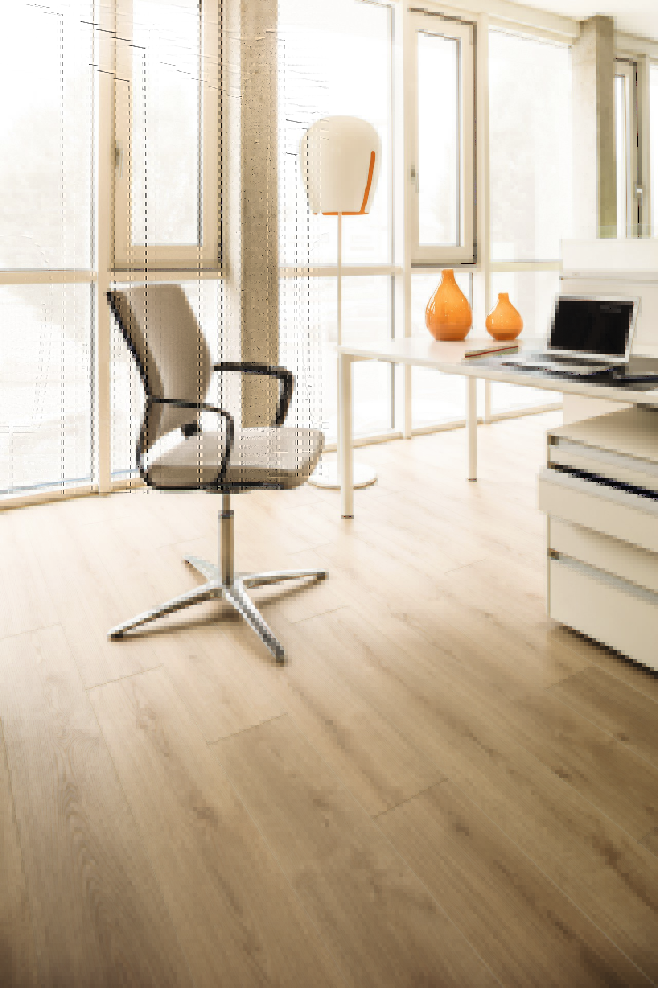 Modern room showcasing the stark contrast between the dark tones of the K4420 Oak Evoke Classic Laminate Flooring and the light, minimalist decor.