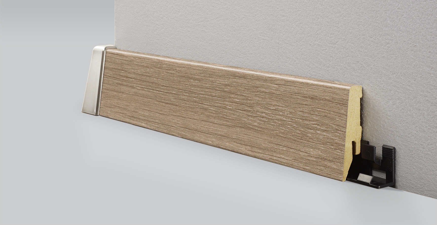 MDF wood floor sill 8634 with cable channel and height 58 mm is suitable for laminate flooring in beige-brown colour.
